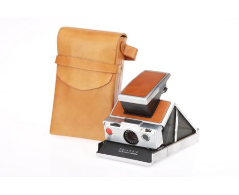 A Polaroid SX-70 Land Camera, brown, body, VG, untested, lens, G-VG, some light internal marks, complete with case