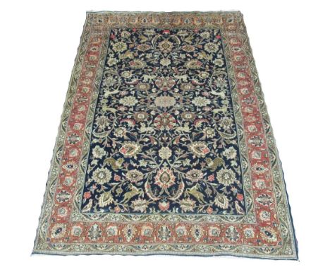 FINE PART SILK QUM RUG, 210cm x 133cm, of all over vine and palmette design on sapphire field within coral border. 