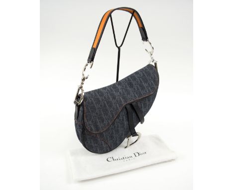 CHRISTIAN DIOR SADDLE BAG, blue denim with silver tone hardware and logo print throughout; orange tonal stitching with dark b