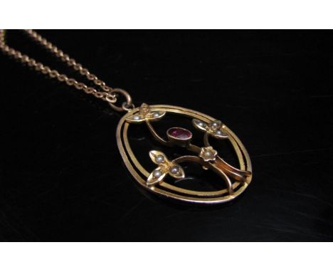 A 9ct gold chain, 46cm long, hung with an Edwardian oval pendant set with garnet and seed pearl, stamped 9ct, 5.7g 