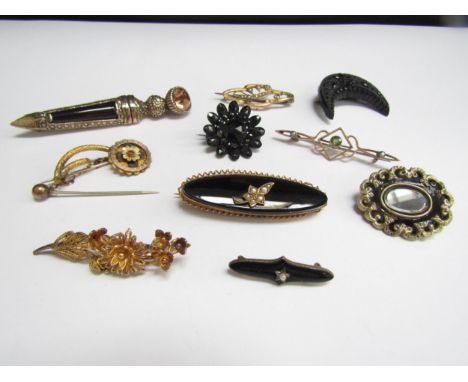 Twelve brooches including 9ct gold example, French jet memorium and Victorian enamel hair panel examples 