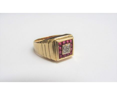 A gold ruby and diamond ring set with four square cut rubies and brilliant cut diamonds, stamped 750. Size Q, 7.4g 