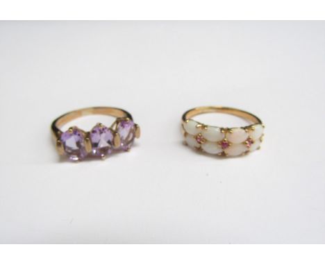 Two 9ct gold rings, one opal and amethyst, size O the other a three stone amethyst example, size L, 5g 