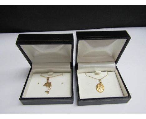 A gold St Christopher pendant hung on chain stamped 375, 46cm long and a gold pendant as a dolphin hung on chain stamped 375,