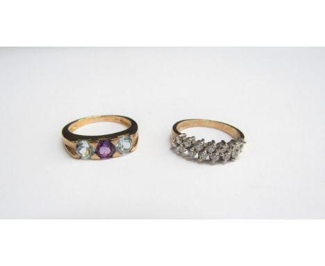 Two 9ct gold rings, amethyst and blue topaz, size K, and cubic zirconia, size L, 5.2g 
