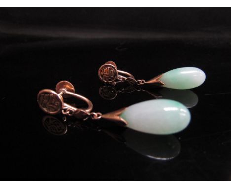 A pair of jade torpedo drop earrings, screw backs stamped 14k, Chinese motif, 4cm drop 