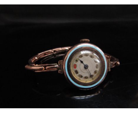 A 9ct gold wristwatch with pale blue enamel band to bezel, 19.5g 