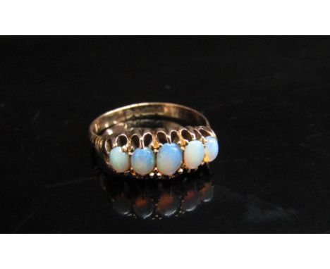 A 9ct gold five stone cabochon opal ring, Chester. Size O, 2.5g 