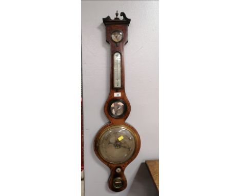 A Thomas Yeates of Penrith mahogany inlaid barometer, height to the top of the finial, approximately 96 cm, width 26 cm 