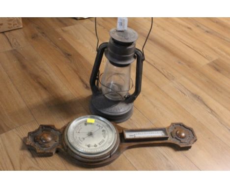 A Tornado storm lamp and a barometer 