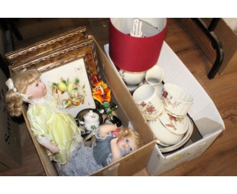 A box of decorative china, lamp pictures and dolls