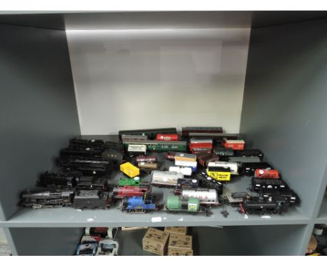 A shelf of playworn 00 gauge including Hornby 4-6-2 Vulcan, 4-6-0 Holyhead, Triang 4-6-0 4983, Wrenn 2-8-0 8F 48073, 2-6-0 un