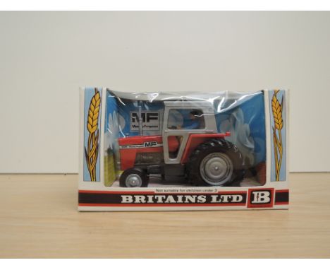 A Britains model, 9522 MF Massey Ferguson 595 Tractor, in original window display box with card insert, appears unused