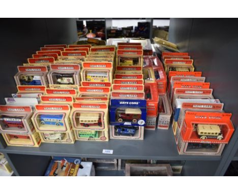 A shelf of Lledo Days Gone die-casts, Vintage Vans, Buses and Cars, all in window display boxes, 120+