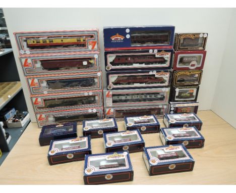 A collection of 00 Rolling Stock comprising, 7 Lima Carriages, 3 Bachmann Carriages, 9 Bachmann Wagons, 2 Mainline Wagons, 2 