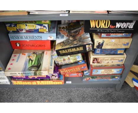 A shelf of mixed vintage games including Waddingtons Mine a Million, Hollywood, Formula One, Rio Grande Change Horses, Notre 