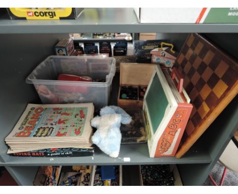 A shelf of mixed toys including two wooden Chess Sets with boards, Beano Comics, Flying Hats Game, Fisher Price Toys etc