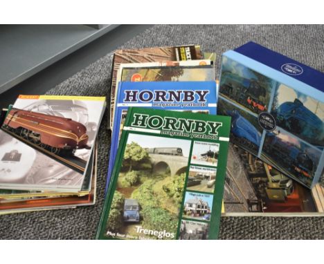 A shelf of Railway related Books and Magazines, mainly Hornby along with a 4 ceramic Cup set by Leonardo