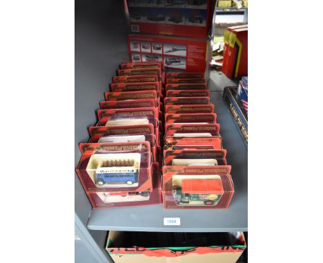 A collection of Matchbox Models of Yesteryear die-casts, Vintage Vans and Cars, all in red window display boxes, 31 in total