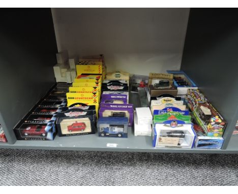 A shelf of modern die-casts including Shell Classico and Sportscar Collections, Vanguards etc, all boxed, approx 50+