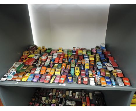 A shelf of playworn die-casts including Matchbox Racing Mini No 29 x2, Dinky Mini Clubman, Britains Tractor and Loader, Lesne