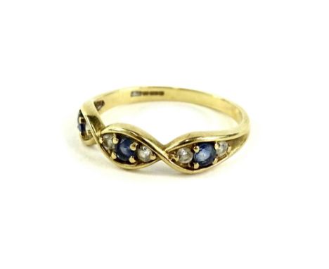 A 9ct gold dress ring, set with three sections each set with single sapphire, flanked by two diamonds, ring size P, 1.9g all 