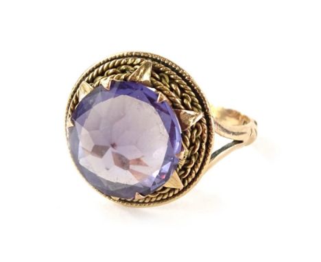 An amethyst dress ring, in yellow metal continental frame, unmarked, valued as 9ct, 4.4g.