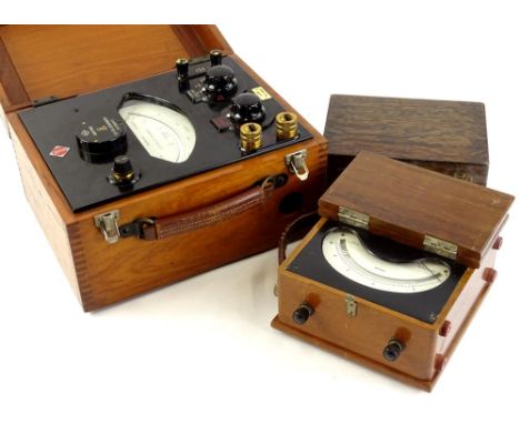A collection of scientific instruments to include a Cambridge Instrument Company Limited AC volt meter in a teak case with ba