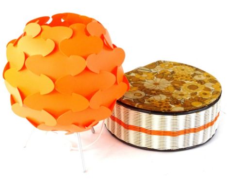 A retro orange plastic sputnik table lamp, and a similar sewing box.
