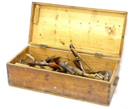 A quantity of tools, to include block planes, braces etc., in a stained pine box.