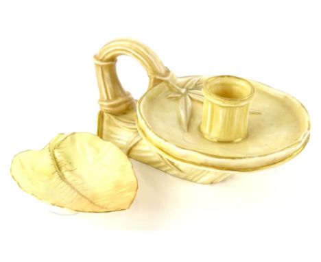 A Royal Worcester blush ivory ground chamberstick, cast to simulate bamboo within gilt borders, printed mark in green to unde