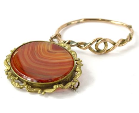 Two items of jewellery, comprising a gold hinged bangle, with knot design centre (AF), with poor repairs not in gold, and an 