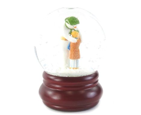 A Coalport characters Snowman limited edition snow globe, titled The Hug Snow Globe.