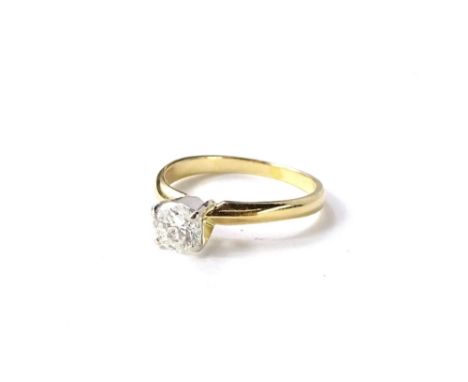 A modern diamond solitaire ring, with round brilliant cut diamond approx 0.59cts, in four claw platinum raised setting, on a 