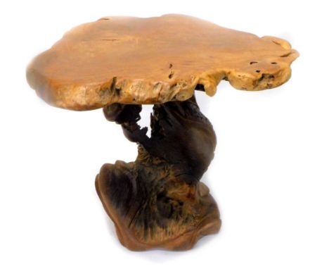 A rustic walnut occasional table, the sliced trunk shaped top, on a similar tapering base, approx 77cm W.