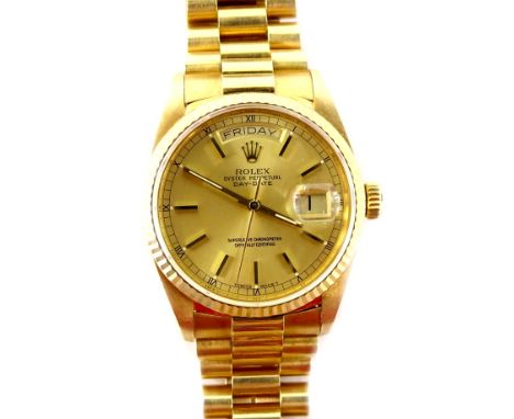 A Rolex Oyster Perpetual Day-Date 18ct gold gentleman's wristwatch, with gilt coloured dial having applied stick batons surro