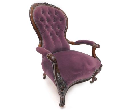 A Victorian mahogany showframe open armchair, the padded button back upholstered in purple fabric, on carved cabriole legs, w