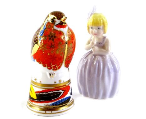 Two Royal Worcester porcelain candle snuffers, a robin and a limited edition of a young girl (2).