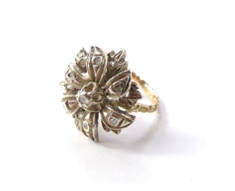 A diamond cluster ring, set with seventeen round brilliant cut diamonds, totalling approx 1ct, each in claw setting in a wire