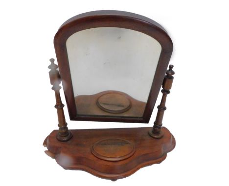 A Victorian mahogany dressing table mirror, with an arched plate on turned supports, the shaped base with a hinged trinket co