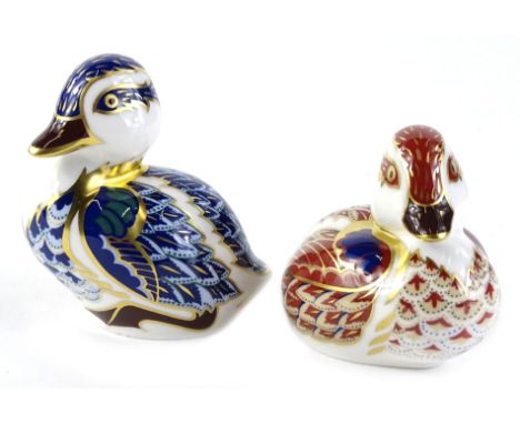 A Royal Crown Derby porcelain duckling, printing mark in red and gold button to underside and another similar. (2)