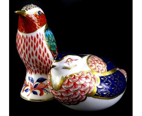 A Royal Crown Derby porcelain figure of a humming bird, gold button to underside, and a quail with gold button. (2)