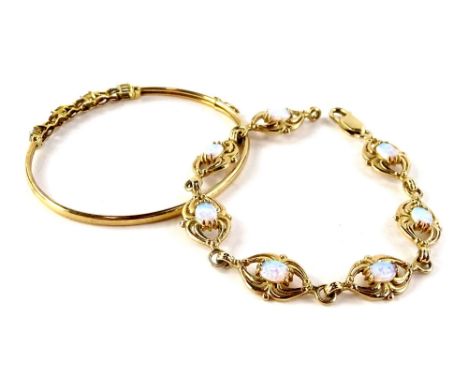 Two modern bracelets, comprising a 9ct gold and imitation opal design bracelet, with seven splayed links, clasp stamped 375, 