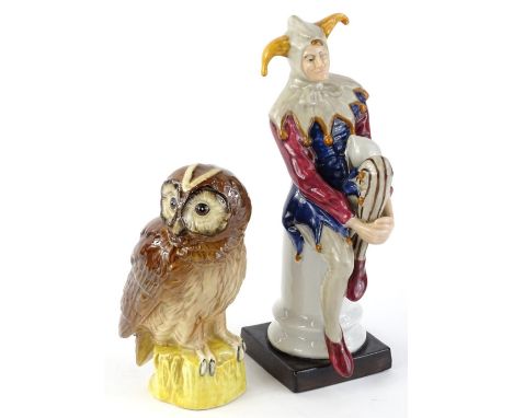 A Leonardo collection Royal Doulton style Jester figure, 25cm H, and a Royal Doulton tawny owl whisky flask.