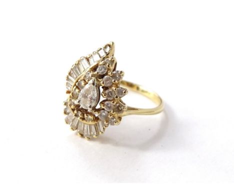 A diamond cluster ring, with sixty five round brilliant cut diamonds of varying size, between 2mm to 3.2mm diameter, claw set