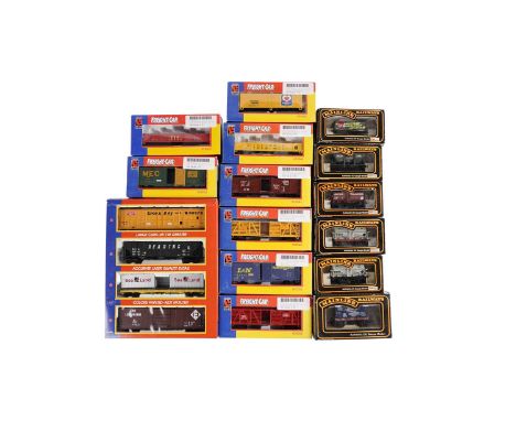 A collection of Palitoy Mainline Railways 00-gauge model rolling stock, comprising: 7 Plank Wagon Persil; Tank Wagon B.P.; Ta