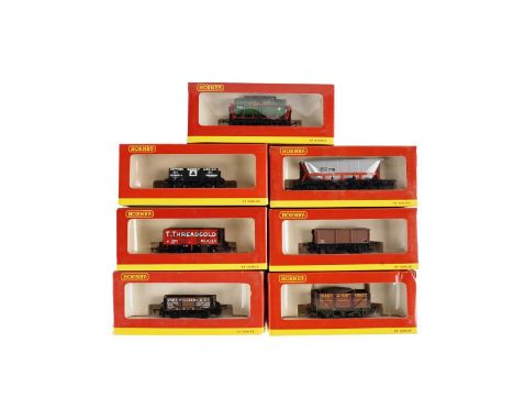 A selection of Hornby 00-gauge rolling stock, all boxed, including: R6198 4 Plank Wagon 'Dutton Massey'; R6201 7 Plank Wagon 