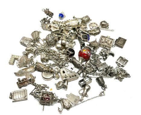 Large selection of vintage silver charm bracelets and loose charms weight 228g 