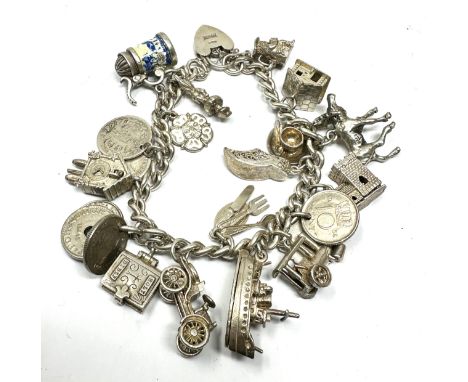 Vintage silver charm bracelet and charms inc opening charms weight 78g 