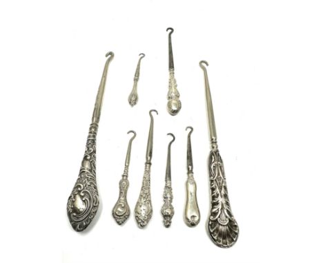 8 Antique silver handle button hooks 